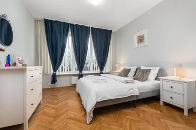 Łóżko lub łóżka w pokoju w obiekcie Apartament Inflancka by Your Freedom