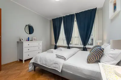 Łóżko lub łóżka w pokoju w obiekcie Apartament Inflancka by Your Freedom