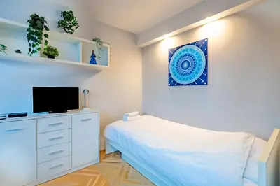 Telewizja i/lub zestaw kina domowego w obiekcie Blue Haven Apartment City Center