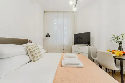 Łóżko lub łóżka w pokoju w obiekcie Cozy City Center Apartment in Warszawa