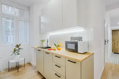 Kuchnia lub aneks kuchenny w obiekcie Cozy City Center Apartment in Warszawa