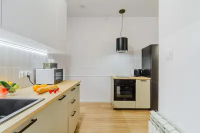 Kuchnia lub aneks kuchenny w obiekcie Cozy City Center Apartment in Warszawa