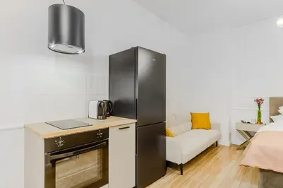 Kuchnia lub aneks kuchenny w obiekcie Cozy City Center Apartment in Warszawa