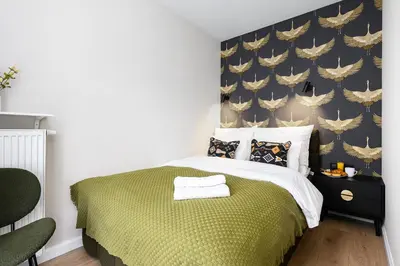 Łóżko lub łóżka w pokoju w obiekcie P&O Apartments Stegny - Mokotów