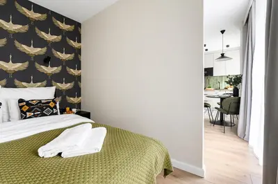 Łóżko lub łóżka w pokoju w obiekcie P&O Apartments Stegny - Mokotów
