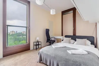 Łóżko lub łóżka w pokoju w obiekcie P&O Apartments Kolejowa IV
