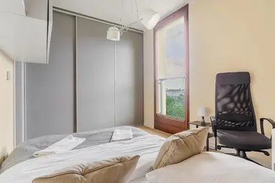Łóżko lub łóżka w pokoju w obiekcie P&O Apartments Kolejowa IV