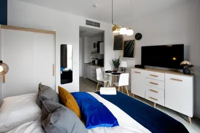 Łóżko lub łóżka w pokoju w obiekcie P&O Apartments Zachodni III
