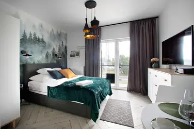 Łóżko lub łóżka w pokoju w obiekcie P&O Apartment Zachodni IV