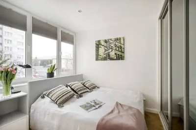 Łóżko lub łóżka w pokoju w obiekcie Blush Suites City Center Nowogrodzka