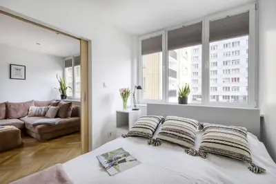 Łóżko lub łóżka w pokoju w obiekcie Blush Suites City Center Nowogrodzka
