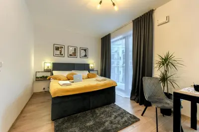Łóżko lub łóżka w pokoju w obiekcie KaZou Residence