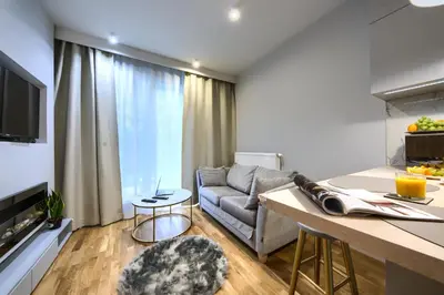 Telewizja i/lub zestaw kina domowego w obiekcie KaZou Residence