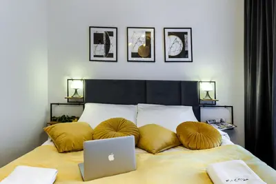 Łóżko lub łóżka w pokoju w obiekcie KaZou Residence
