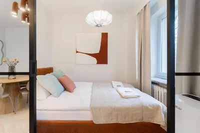 Łóżko lub łóżka w pokoju w obiekcie Warsaw Concierge Waszyngton II