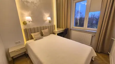 Łóżko lub łóżka w pokoju w obiekcie Apt Ligocka Premium - Apartamenty Wypoczynkowe
