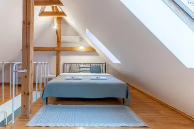 Łóżko lub łóżka w pokoju w obiekcie Warsaw Concierge Podwale