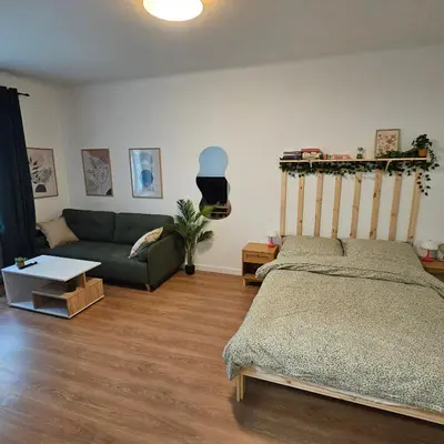 Łóżko lub łóżka w pokoju w obiekcie Smulikowskiego Flat 25