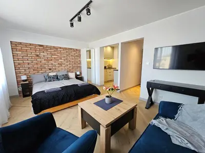 Łóżko lub łóżka w pokoju w obiekcie PAG Apart