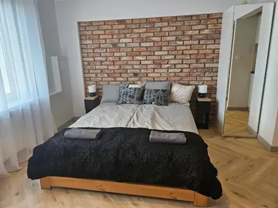 Łóżko lub łóżka w pokoju w obiekcie PAG Apart