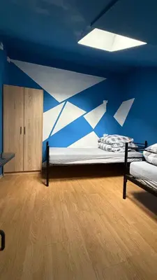 Łóżko lub łóżka w pokoju w obiekcie Dom SOFIIA