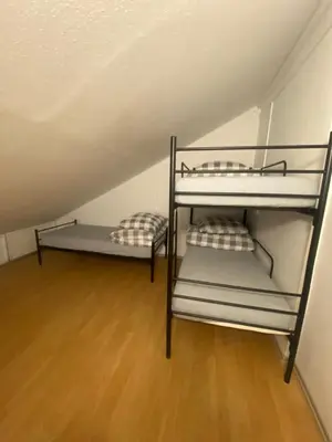 Łóżko lub łóżka w pokoju w obiekcie Dom SOFIIA