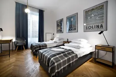 Łóżko lub łóżka w pokoju w obiekcie P&O Apartments Warecka III