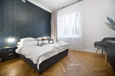 Łóżko lub łóżka w pokoju w obiekcie P&O Apartments Warecka III