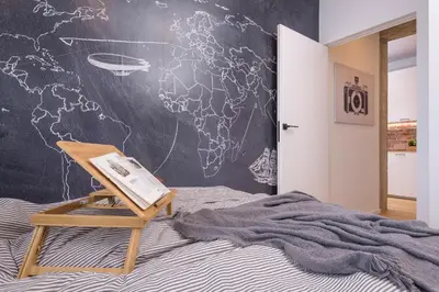Łóżko lub łóżka w pokoju w obiekcie Bon Voyage Apartment Ochota