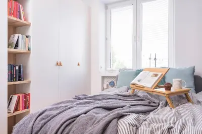 Łóżko lub łóżka w pokoju w obiekcie Bon Voyage Apartment Ochota