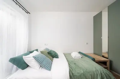 Łóżko lub łóżka w pokoju w obiekcie Praga Bliska Pleasant Studio by BookingHost