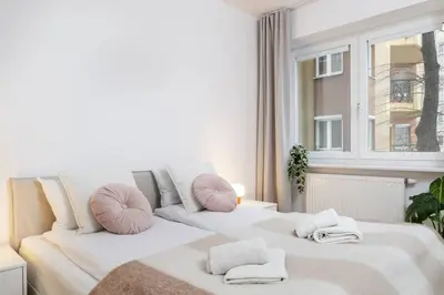 Łóżko lub łóżka w pokoju w obiekcie Creme de la Creme 2 Bedroom Apartment Mokotow