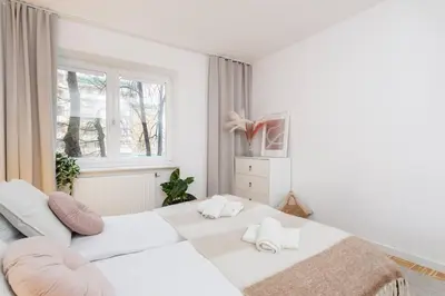 Łóżko lub łóżka w pokoju w obiekcie Creme de la Creme 2 Bedroom Apartment Mokotow