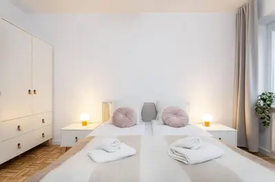 Łóżko lub łóżka w pokoju w obiekcie Creme de la Creme 2 Bedroom Apartment Mokotow