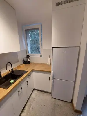 Kuchnia lub aneks kuchenny w obiekcie Cosy apartment Muranów