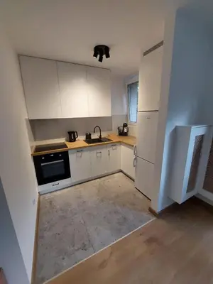 Kuchnia lub aneks kuchenny w obiekcie Cosy apartment Muranów