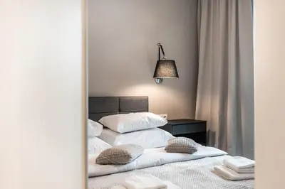 Łóżko lub łóżka w pokoju w obiekcie P&O Apartments Mennica Residence III
