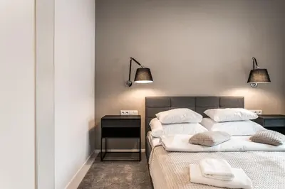 Łóżko lub łóżka w pokoju w obiekcie P&O Apartments Mennica Residence III