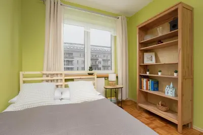 Łóżko lub łóżka w pokoju w obiekcie Stryjeńskich Cozy Apartment with Balcony in Warsaw Ursynów district by Noclegi Renters