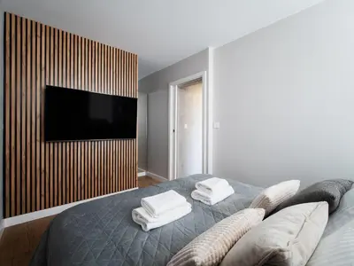 Łóżko lub łóżka w pokoju w obiekcie Apartament Saski Zakątek