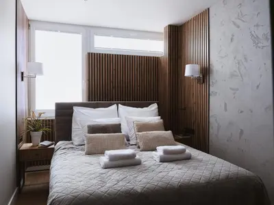 Łóżko lub łóżka w pokoju w obiekcie Apartament Saski Zakątek