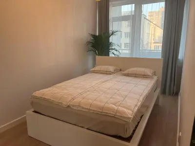 Łóżko lub łóżka w pokoju w obiekcie Apartment Mokotów Domaniewska