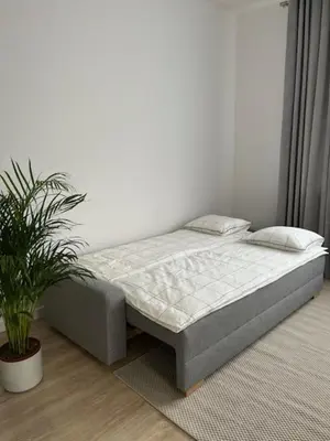 Łóżko lub łóżka w pokoju w obiekcie Apartment Mokotów Domaniewska