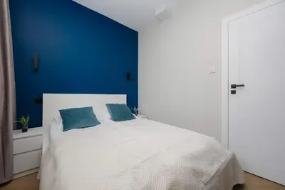 Łóżko lub łóżka w pokoju w obiekcie Apartament w Sercu Warszawy Biurko do Pracy Zdalnej by Noclegi Renters