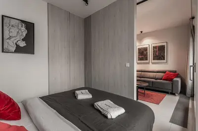 Łóżko lub łóżka w pokoju w obiekcie P&O Apartments Mennica Residence VIII