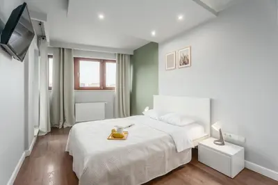 Łóżko lub łóżka w pokoju w obiekcie Warsaw City Premium Apartments