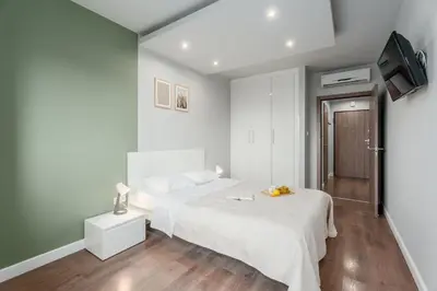 Łóżko lub łóżka w pokoju w obiekcie Warsaw City Premium Apartments