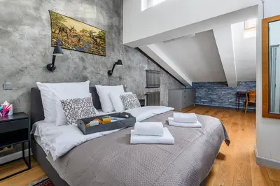 Łóżko lub łóżka w pokoju w obiekcie P&O Apartments Chmielna