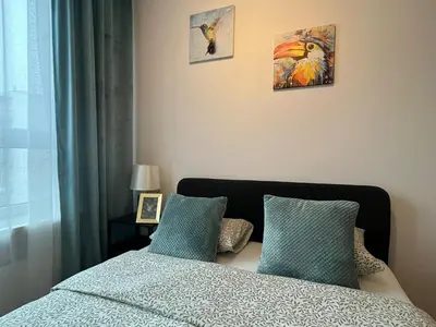 Łóżko lub łóżka w pokoju w obiekcie Rental Apartments Jutrzenki