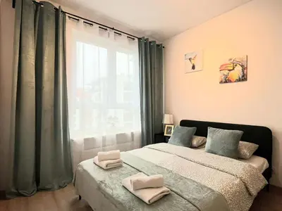 Łóżko lub łóżka w pokoju w obiekcie Rental Apartments Jutrzenki